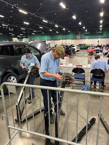 students working on skills in open area for automotive competition